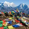 Buddhist prayer flags at the summit of Pikey Peak, Nepal